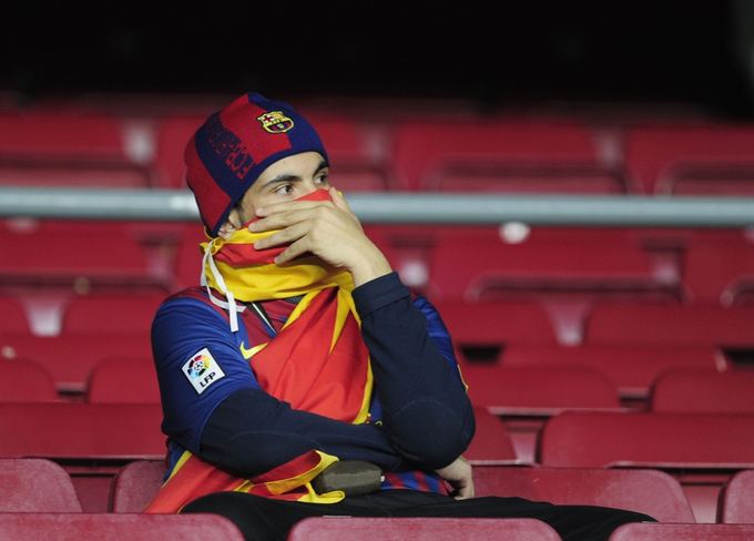 AFP/Scanpix nuotr./Barselonos futbolo gerbėjas