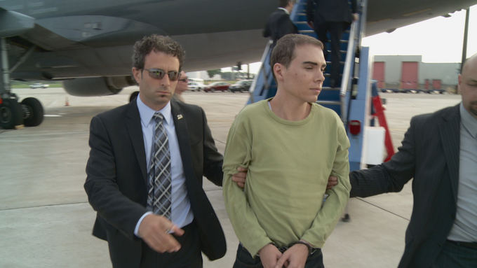 Reuters/Scanpix nuotr./Kanados psichopatas Luka Rocco Magnotta iaduotas Kanadai
