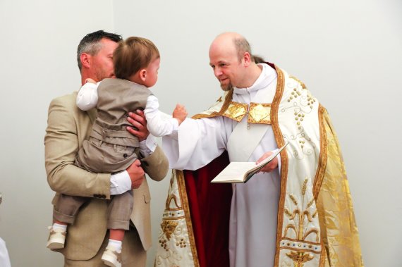 Photo by Vaidas Grudis. Moments of the christening of Nikolas, son of Gerda and Andrius Žemaičiai