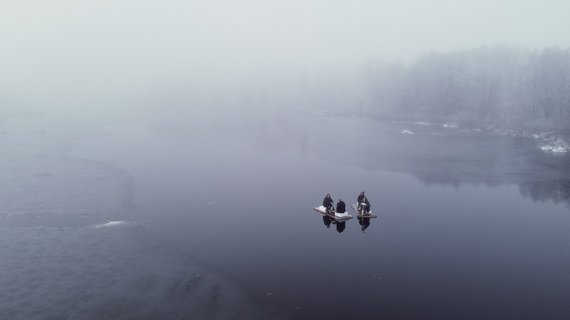 Photo from personal archive / Friends rafting in winter in a pond without ice