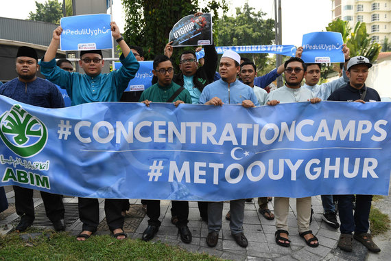 AFP / Scanpix photo / Protest against exploitation of Uighurs in Malaysia