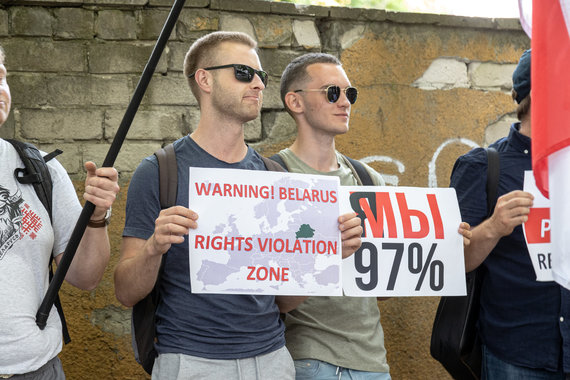 Scanpix photo / Protesters hold a sign with 